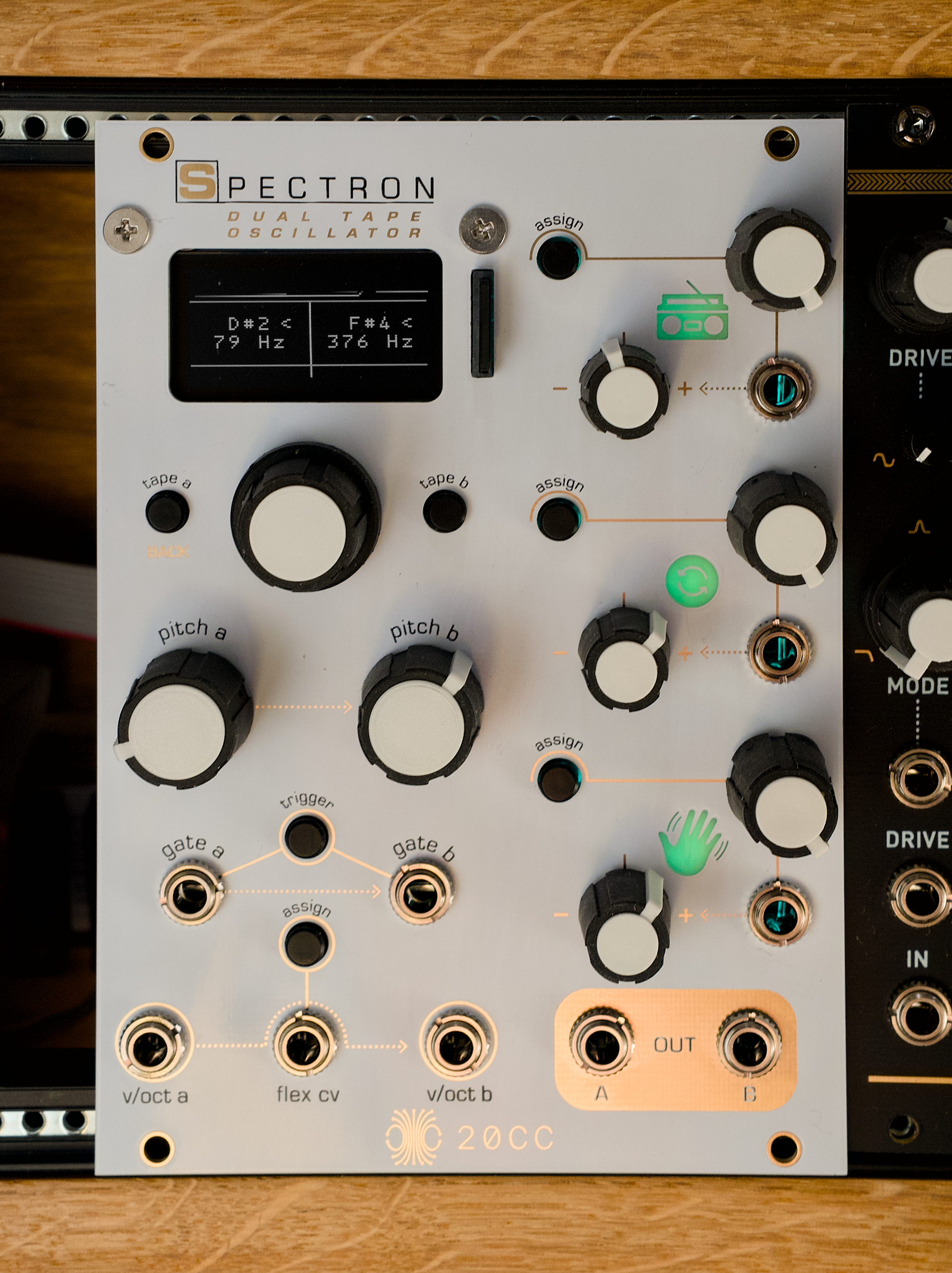 Head on photo of Spectron with white faceplate