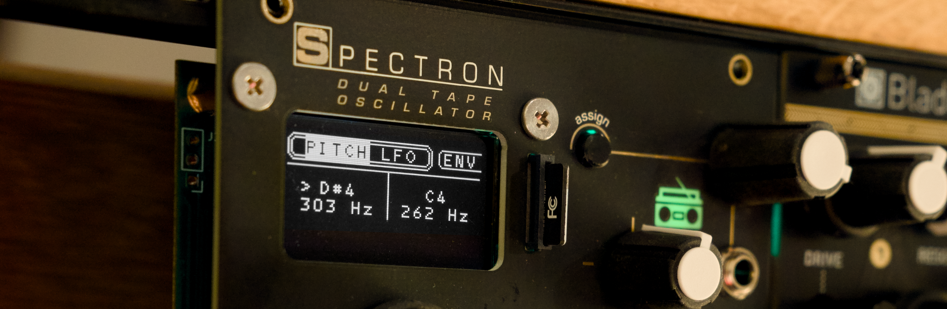 Angled photo of Spectron with black faceplate